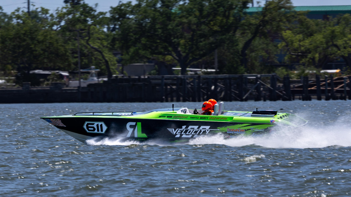 Ride Legal Velocity offshore powerboat #611 at full speed on the water, driven by Bob Springer with Scott McCormick on throttle, during the Thunder on Cocoa Beach race