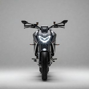 Front-facing view of a sleek black electric motorcycle with sharp LED headlights, positioned against a plain gray studio background.