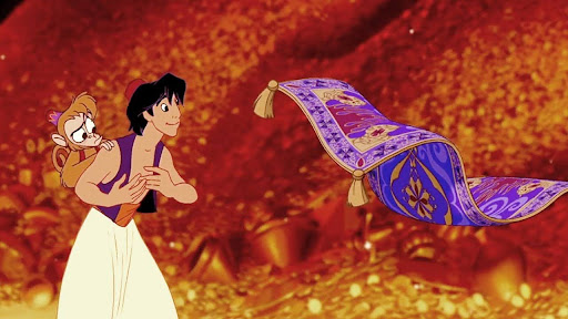 An animated scene shows Aladdin holding Abu the monkey as a magical purple carpet floats in midair before them, surrounded by a shimmering sea of golden treasure inside a cave.