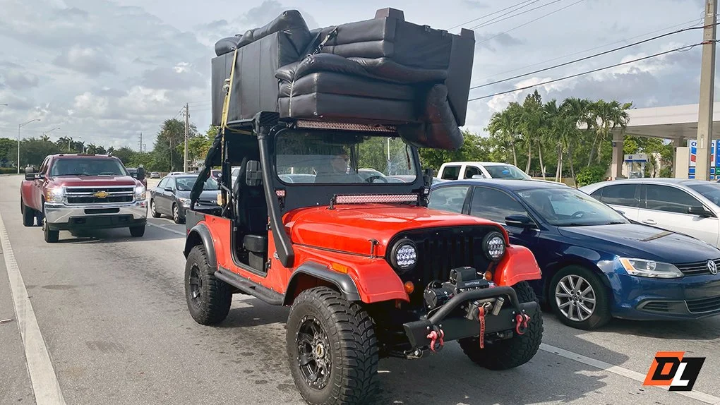 street legal utv hauling a sofa on the roof