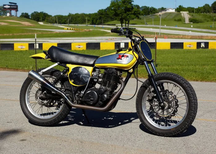 A vintage Yamaha XT Supermoto on street