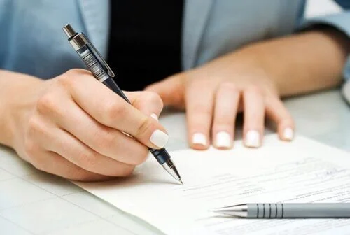 signing a paper