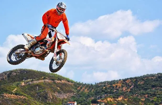 dirt bike rider jumping in the air