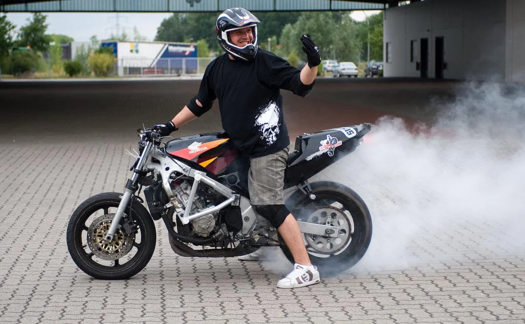 man doing motorcycle burnout