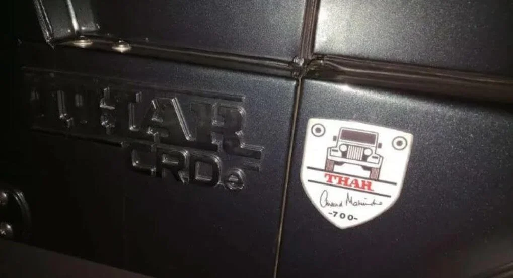 Mahindra Roxor 4x4 vehicle badge and Utah nameplate on dark exterior, showing iconic Jeep-style design details