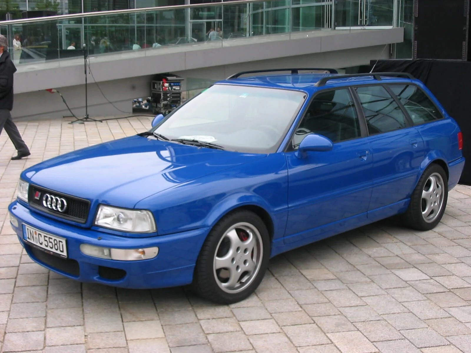 Blue Audi RS2 wagon displayed at outdoor event, highly collectible performance car model