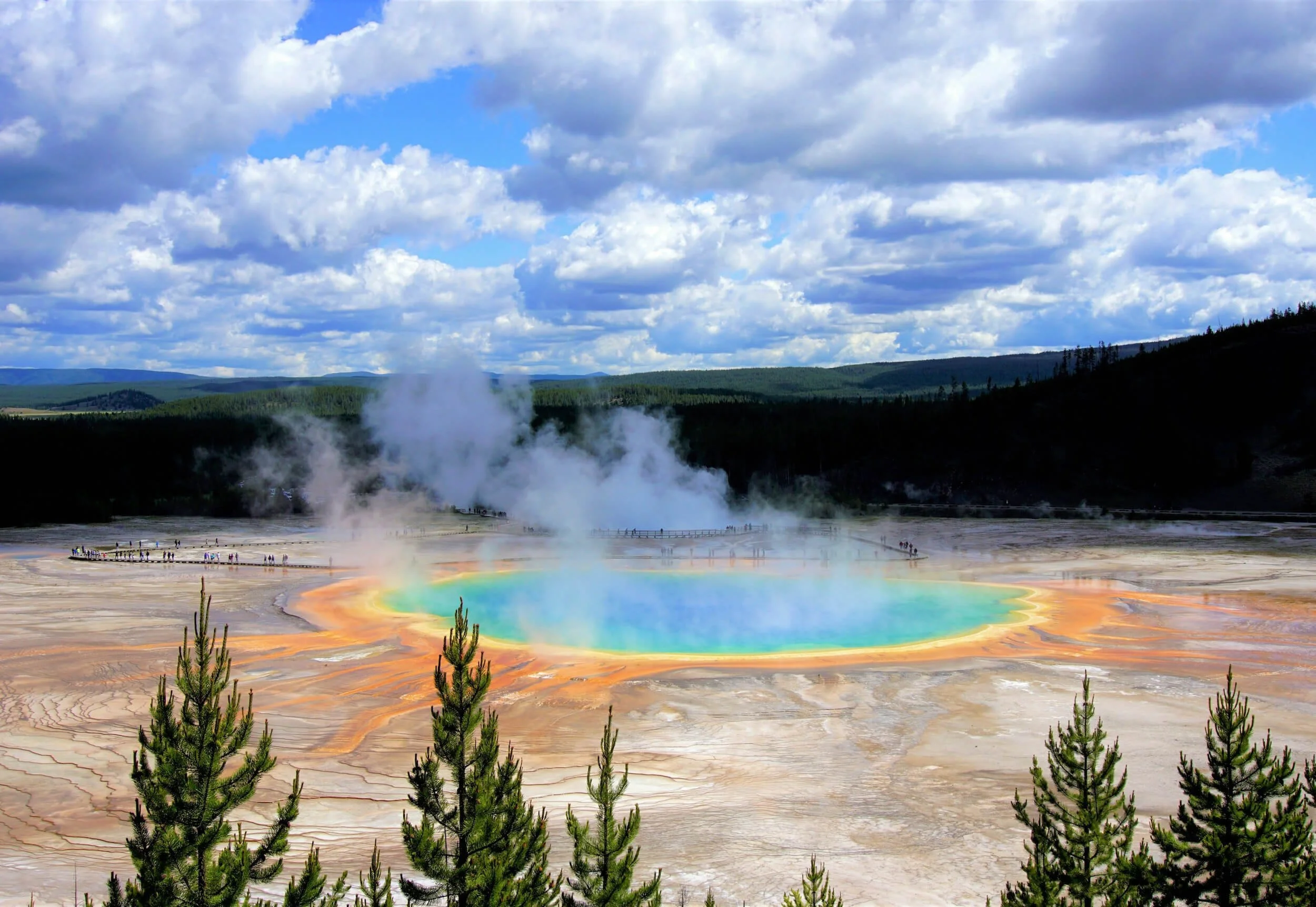 Grand Prismatic Spring geothermal hot spring in Yellowstone National Park Montana with colorful mineral deposits