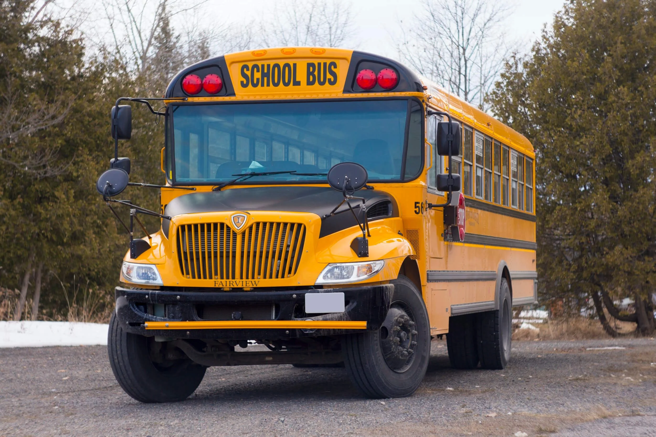 Yellow school bus parked outdoors, converted skoolie RV alternative to motorhomes for travel and living.