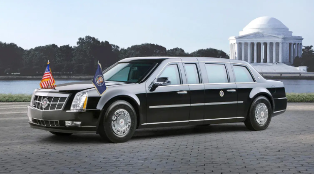 Black presidential limousine parked near Jefferson Memorial, iconic American leader vehicle displaying official flags