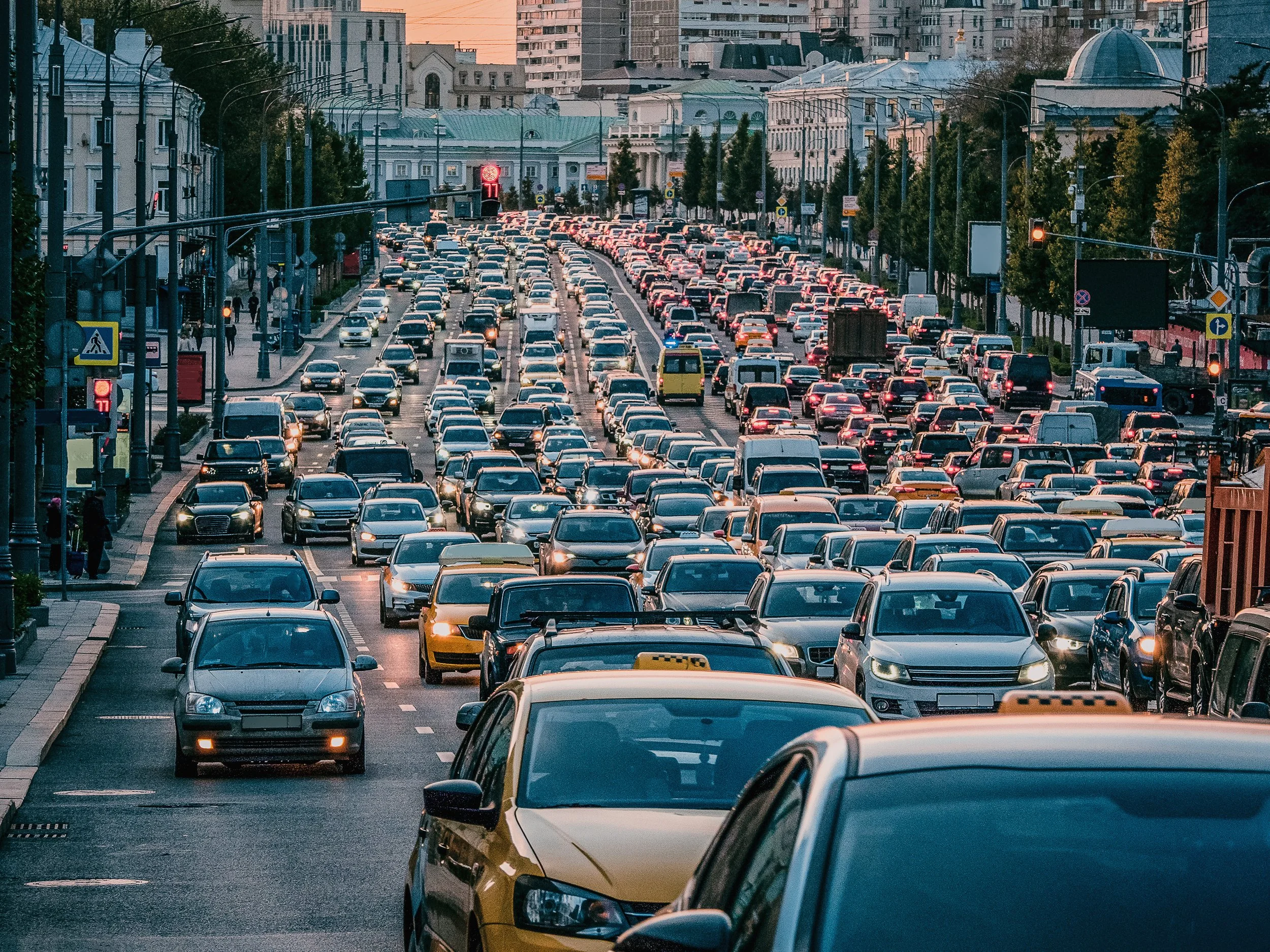 Massive traffic jam on busy city street during rush hour with hundreds of cars congested together