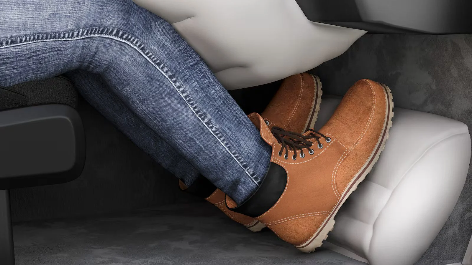 Person wearing brown boots and jeans sitting in car seat, demonstrating heel airbag technology for crash injury prevention.