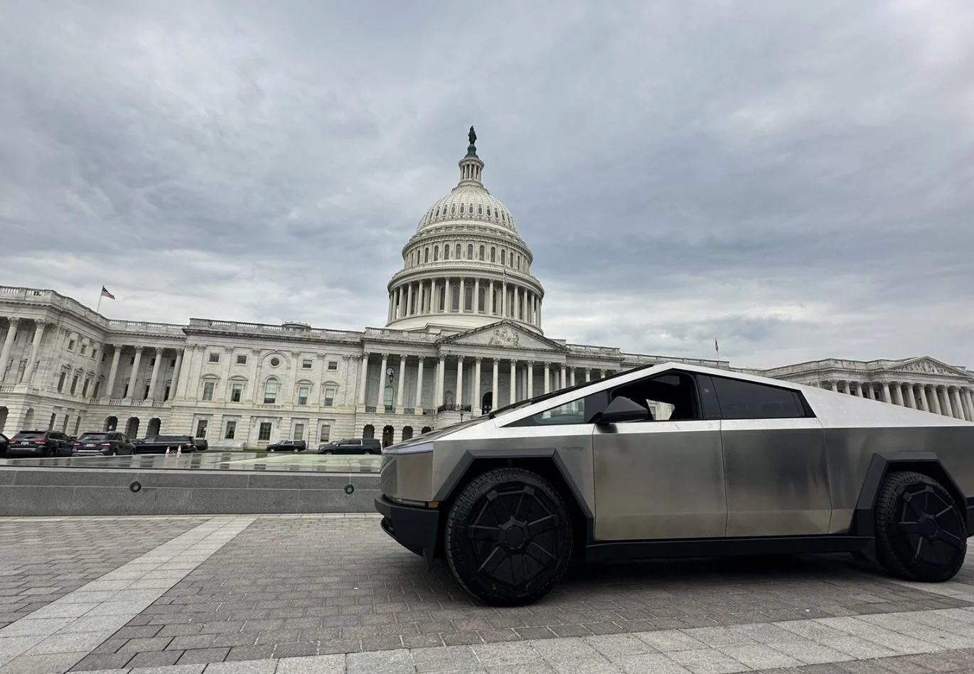 Tesla Cybertruck parked in front of U.S. Capitol Building, illustrating State Department's canceled armored vehicle