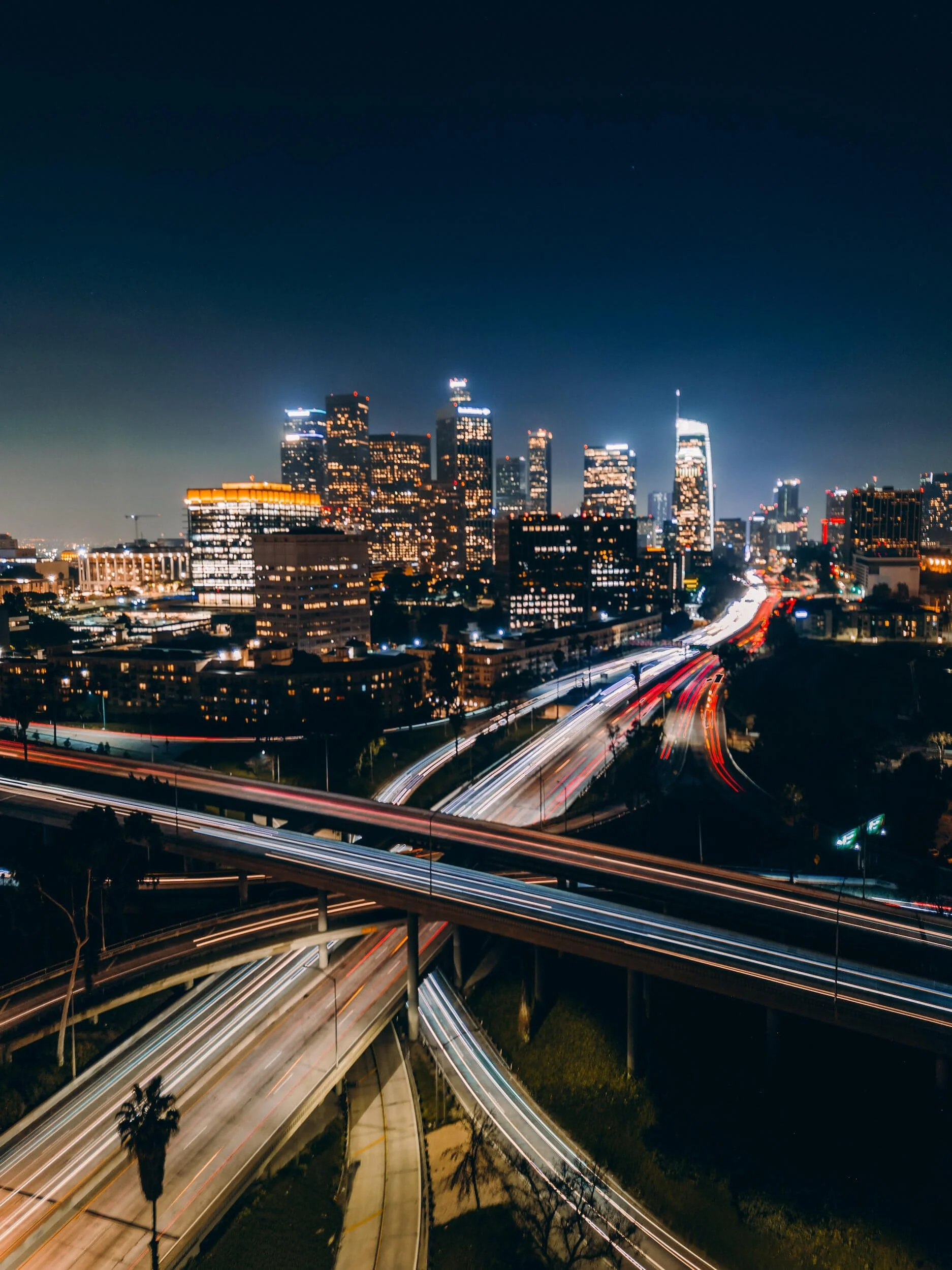 cars passing by bridge in LA