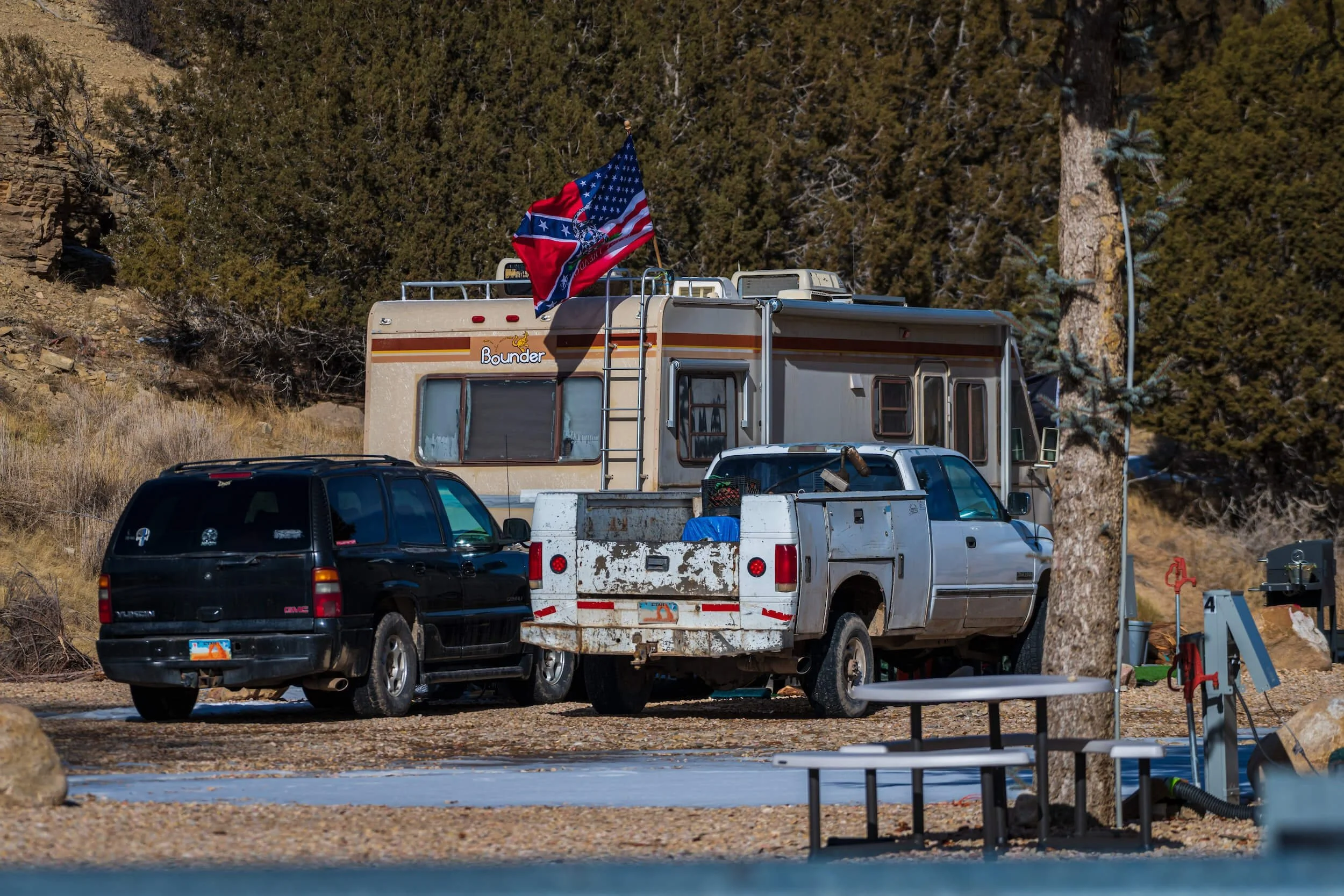 RV parked beside other vehicles