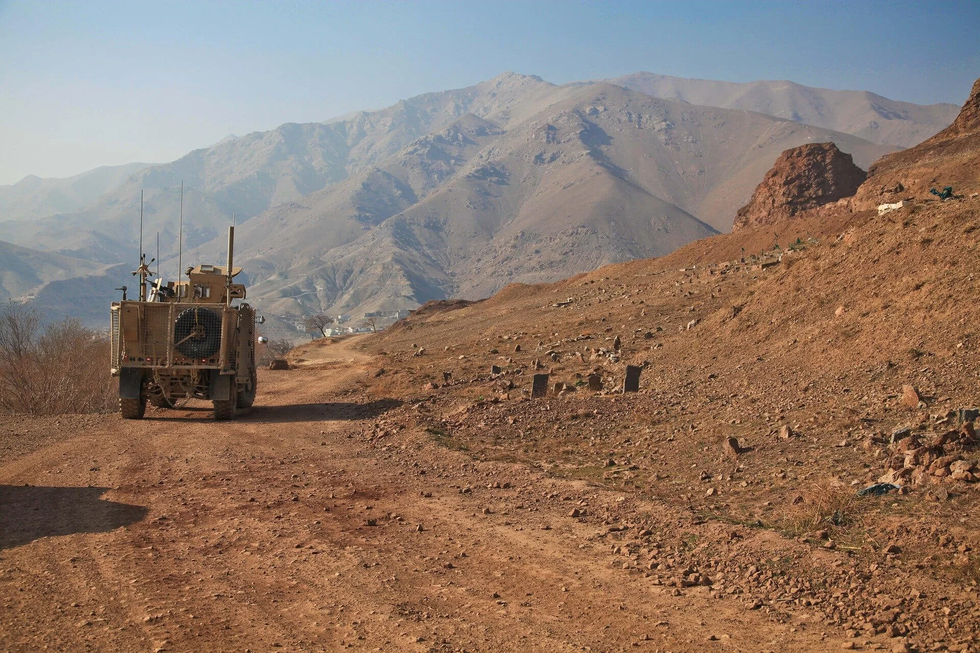military vehicle on dirt road