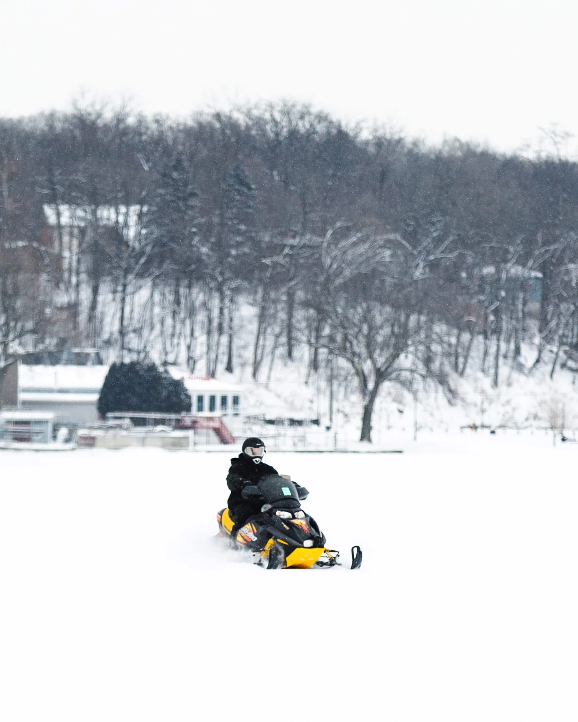 man riding snowmobile
