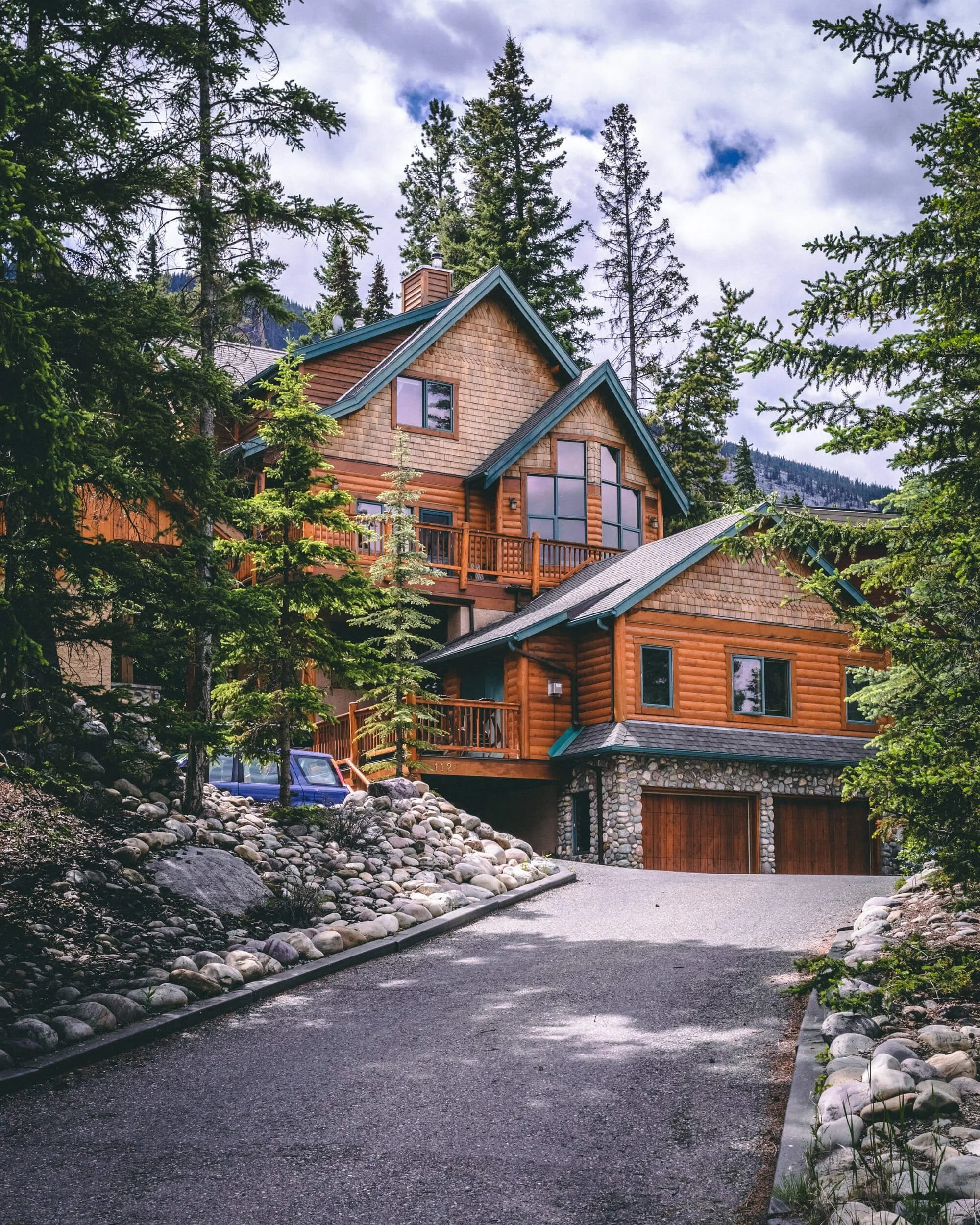 brick house near green trees