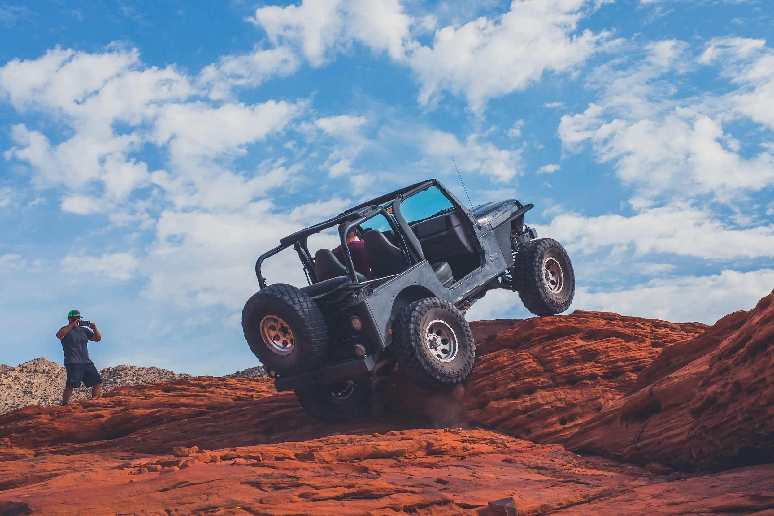 4x4 vehicle climbing rock