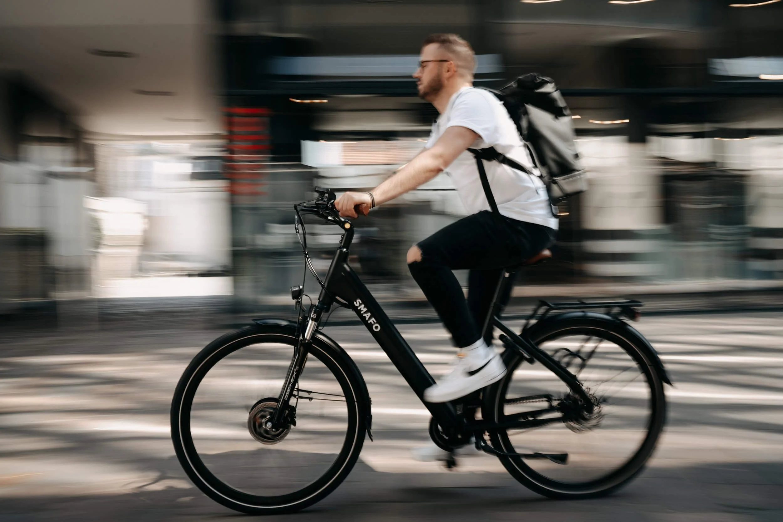 man riding e-bike