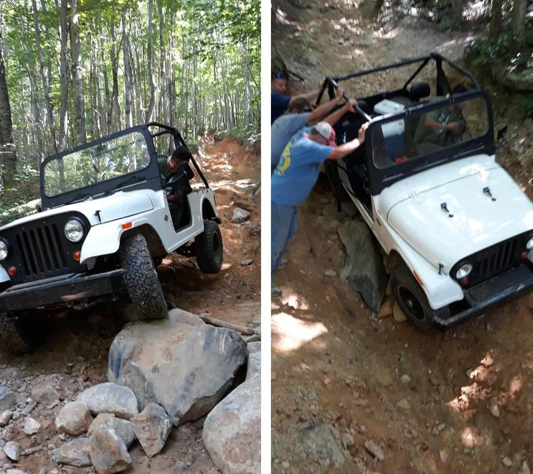 people pushing Mahindra Roxor off road
