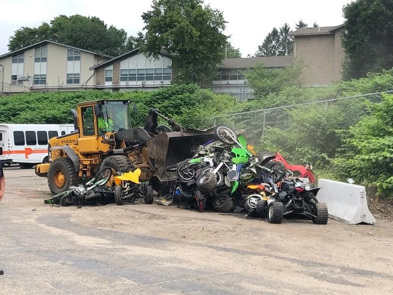 confiscated dirt bikes getting crushed