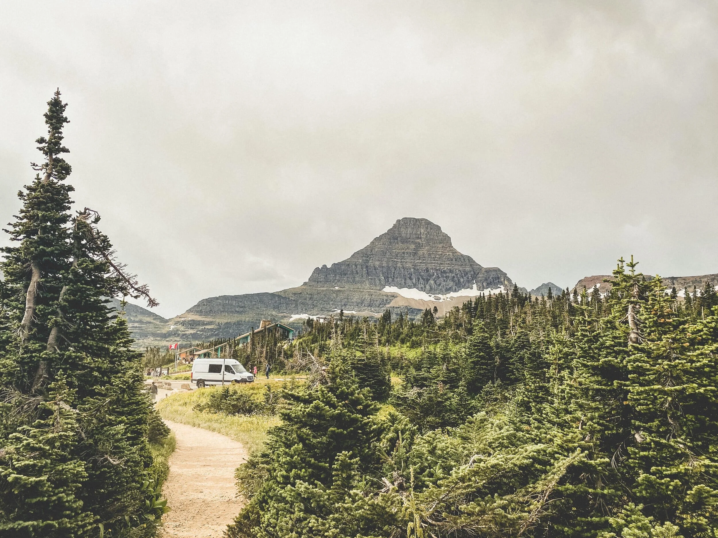 RV beside road on green mountain