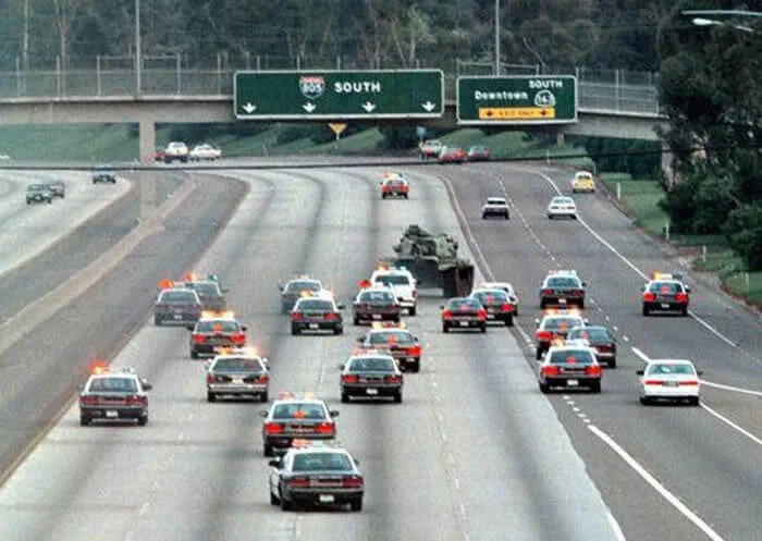 tank on street with other vehicles
