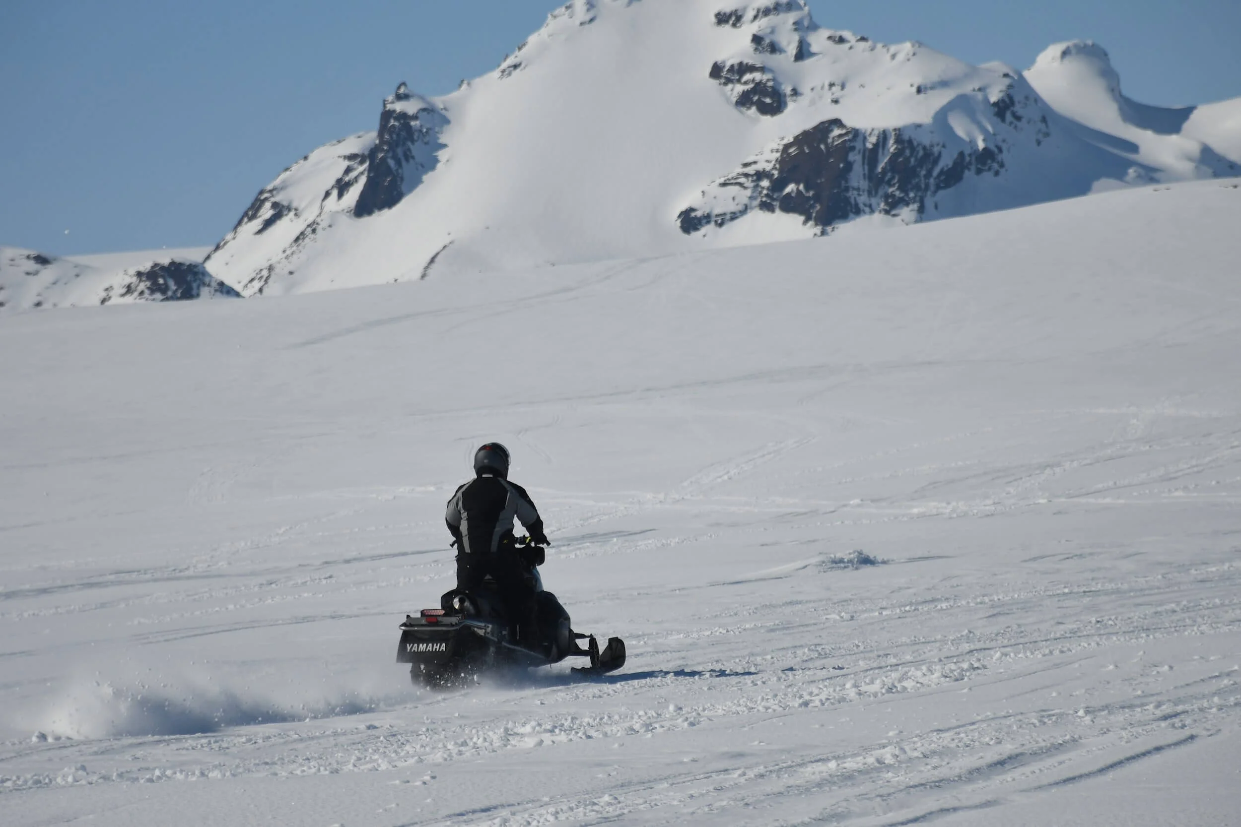 man driving snowmobile