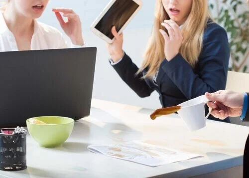 spilling coffee on office desk