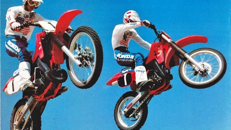 vintage dirt bikes in the air