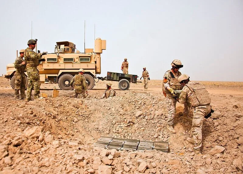 army persons and military trailer