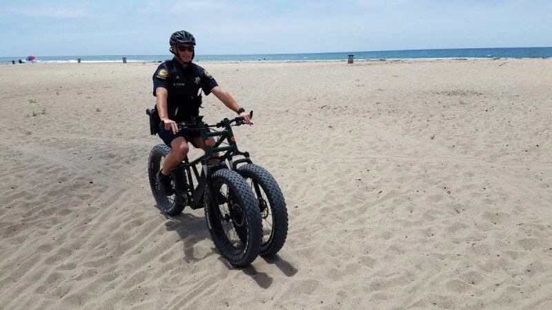 cop riding Rungu Three-Wheeled e-Bike
