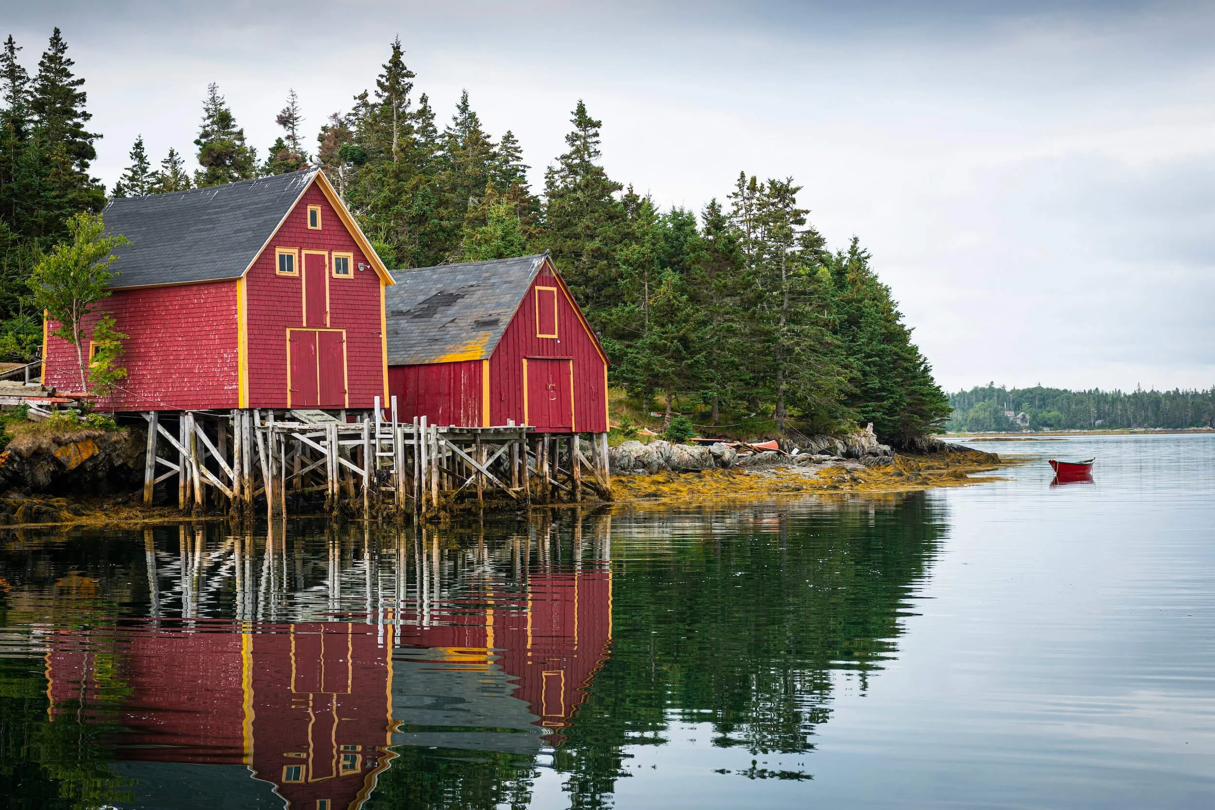 red houses beside lake in Canada