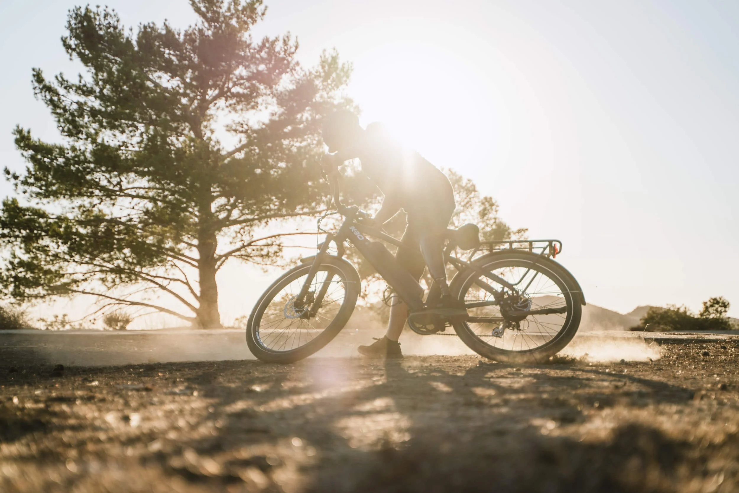 a man riding down the dirt road