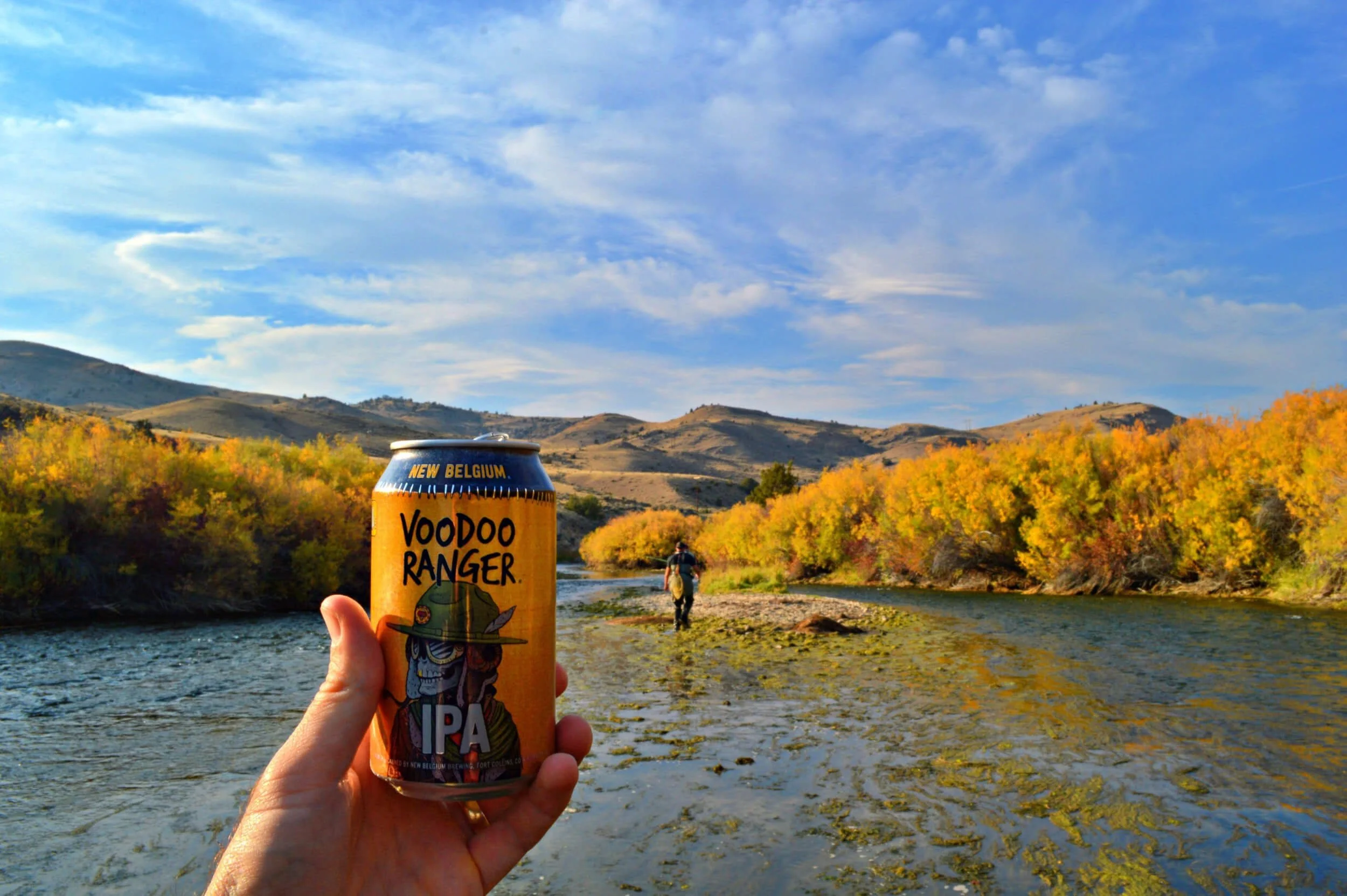 person holding  Voodoo Ranger can at Beaverhead River, Montana