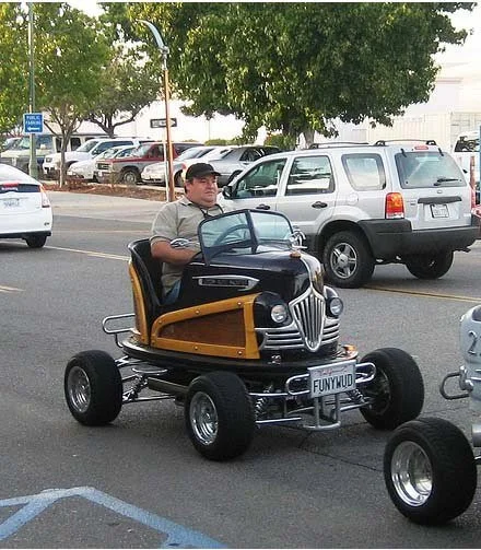 man driving go kart on street