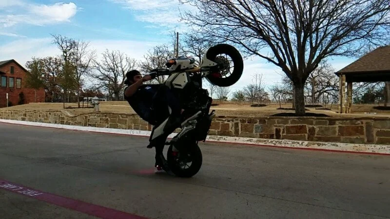 Honda Grom wheelie on street