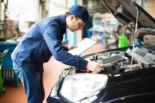 inspecting car engine