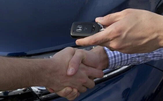 getting car keys and handshake