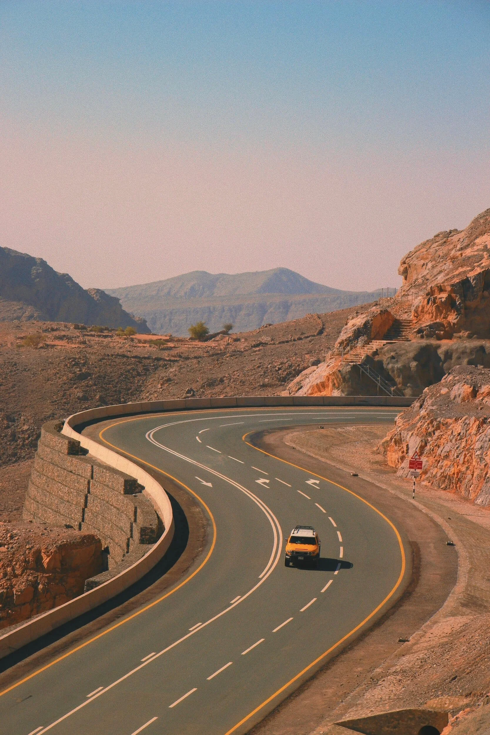 car on street beside mountain