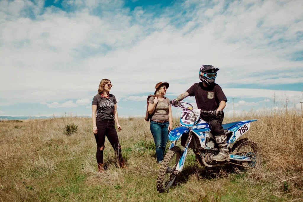 2 ladies and a dirt bike rider