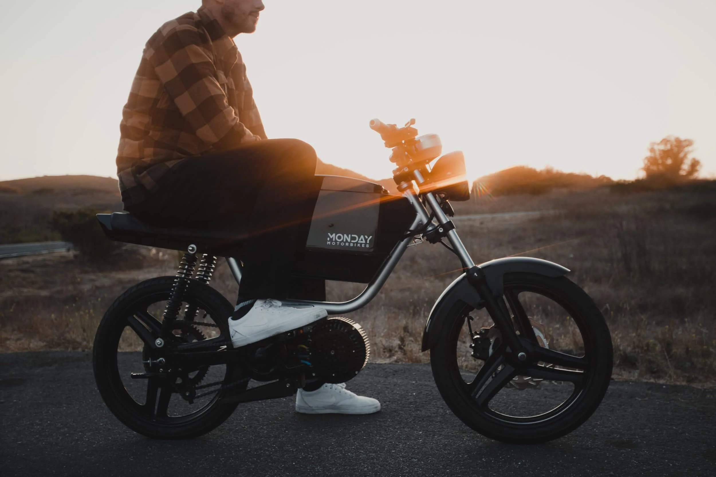 man sitting on a moped