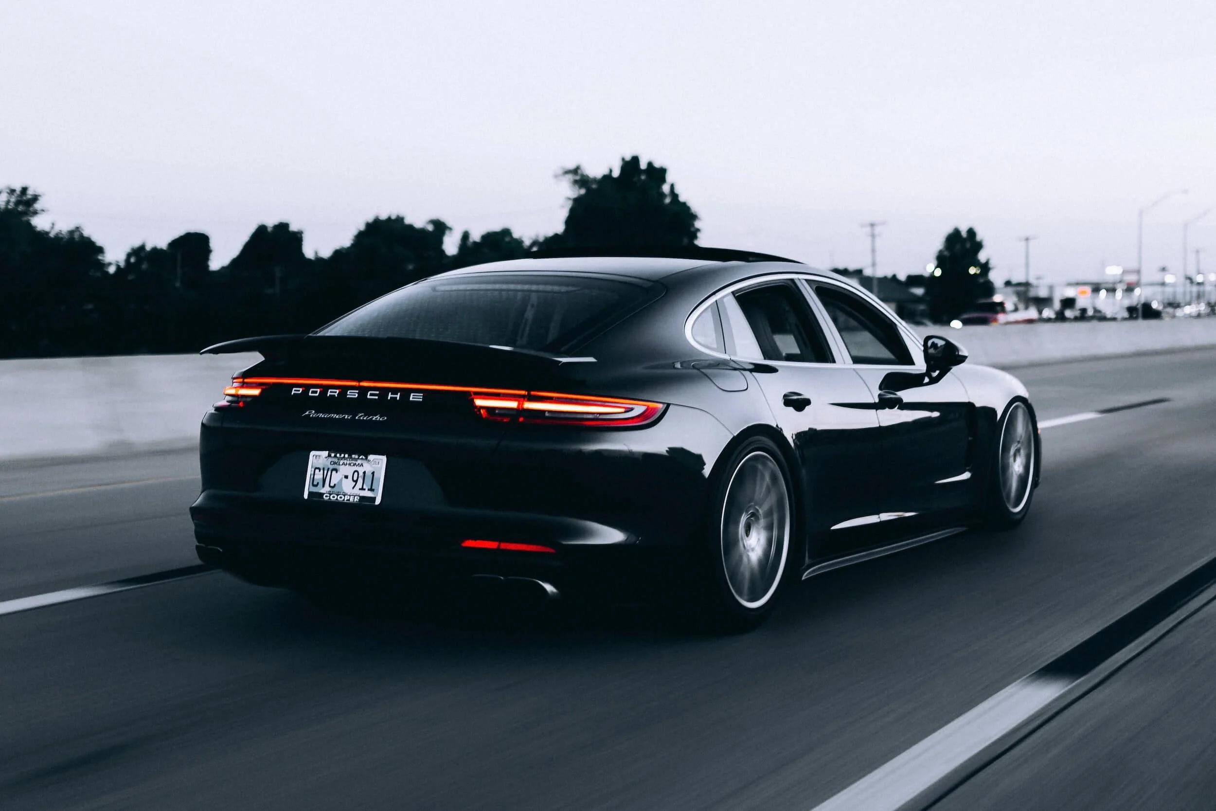 running black porsche sedan for Turo