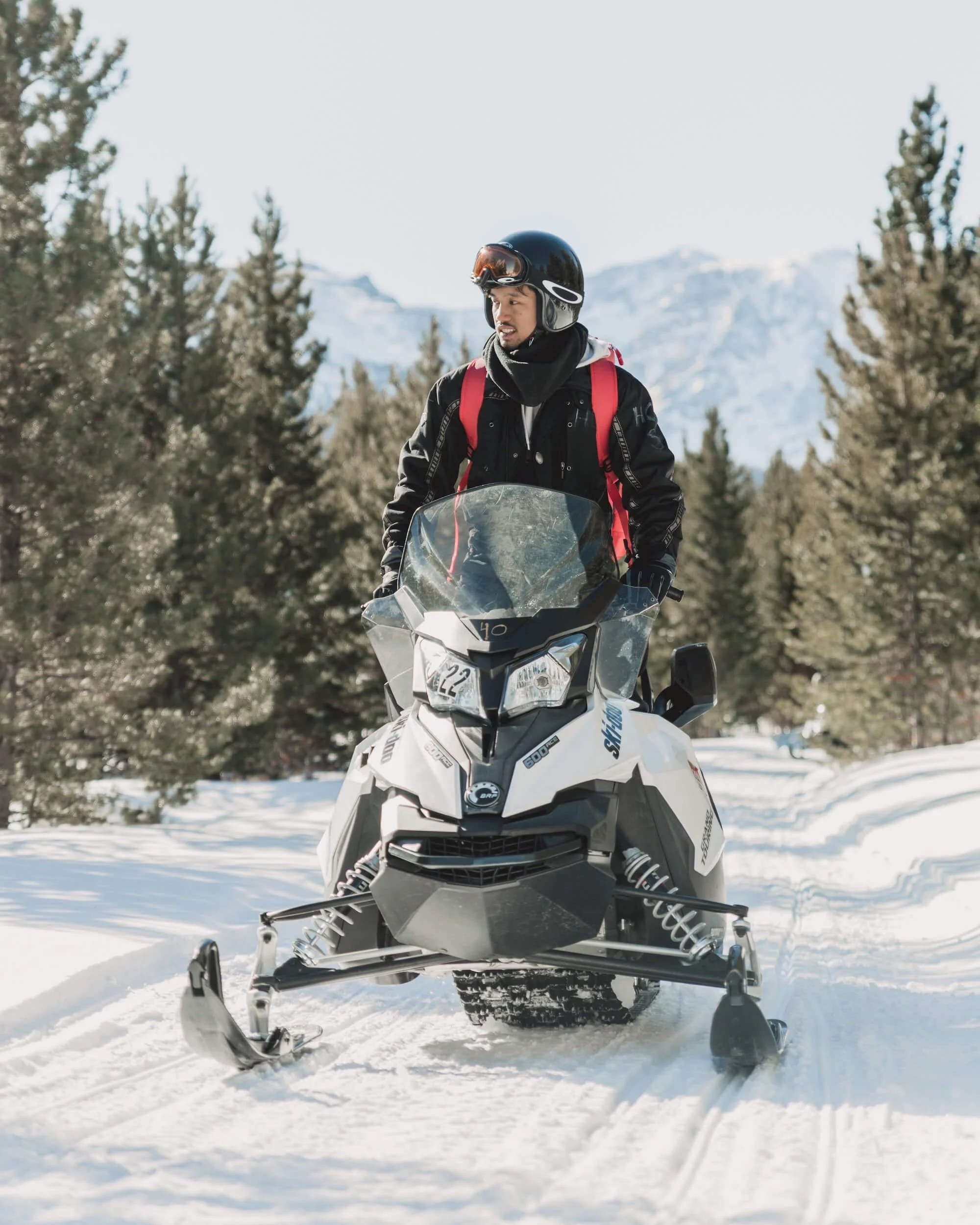 man driving snowmobile