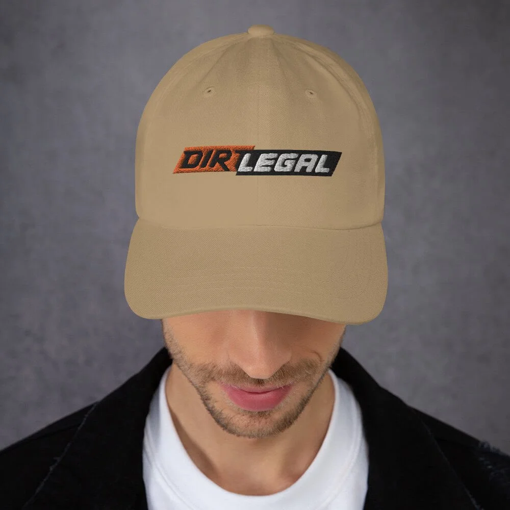 man wearing dirt legal cap