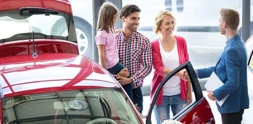 family at car dealer