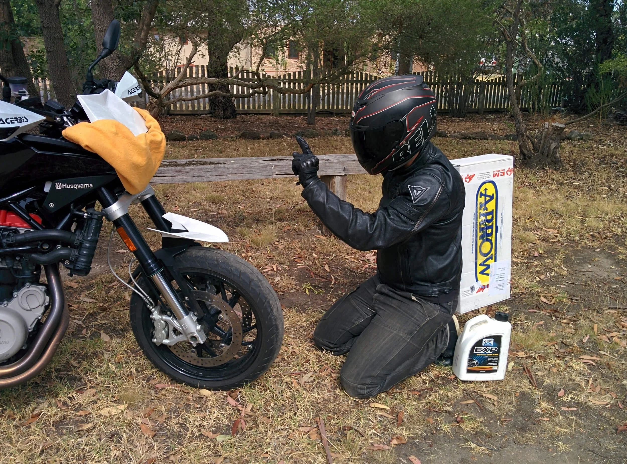 guy with helmet in front of dirt bike