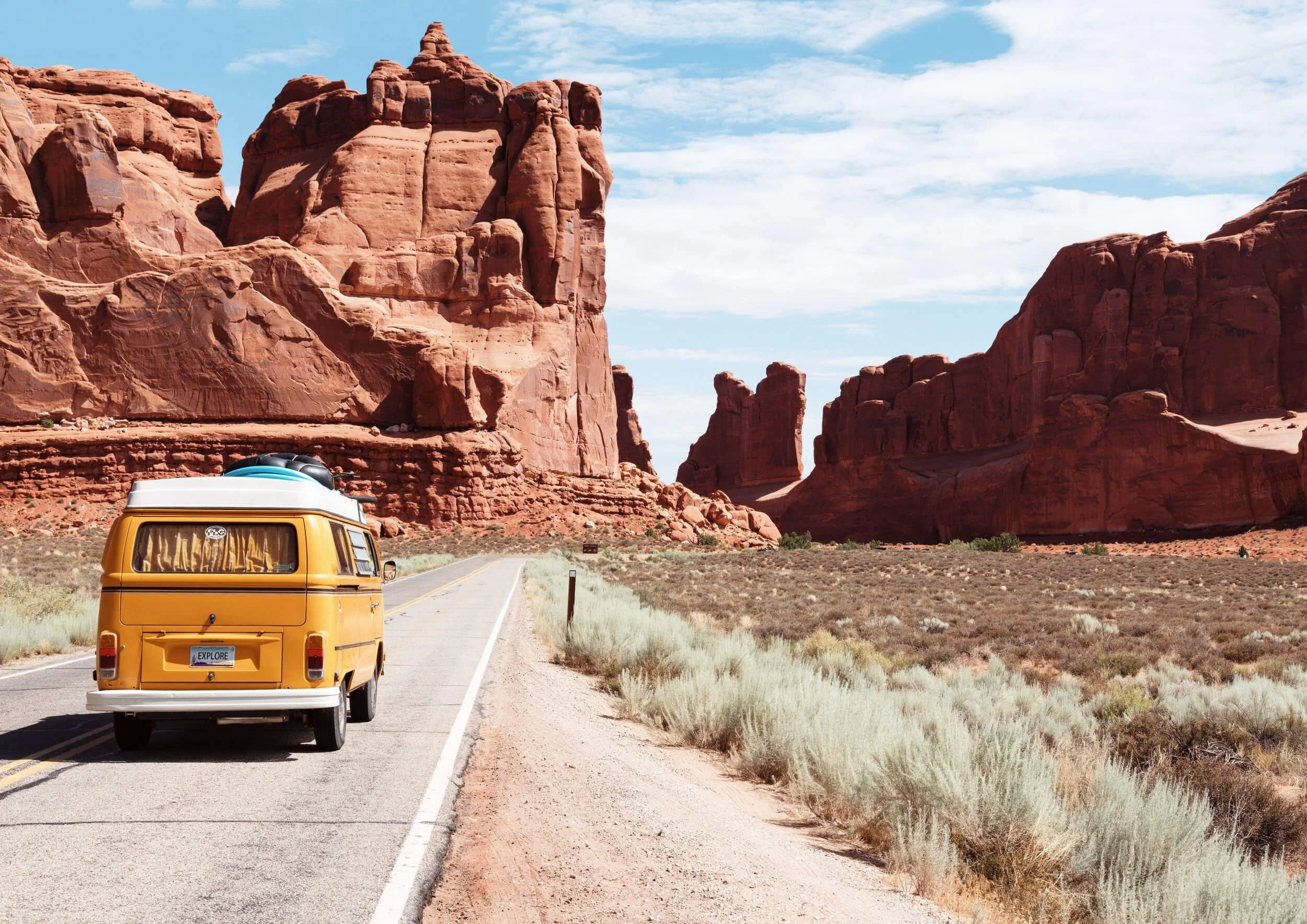 van on street beside mountain